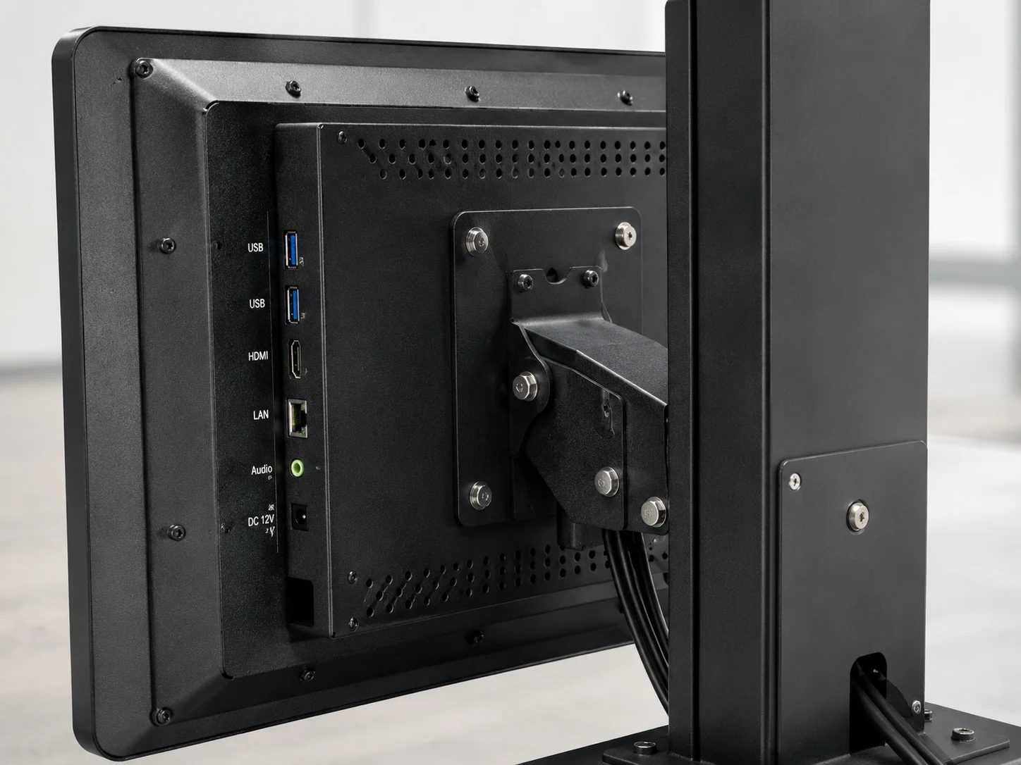 Close up of metal housing and secure mounting brackets on a kiosk monitor